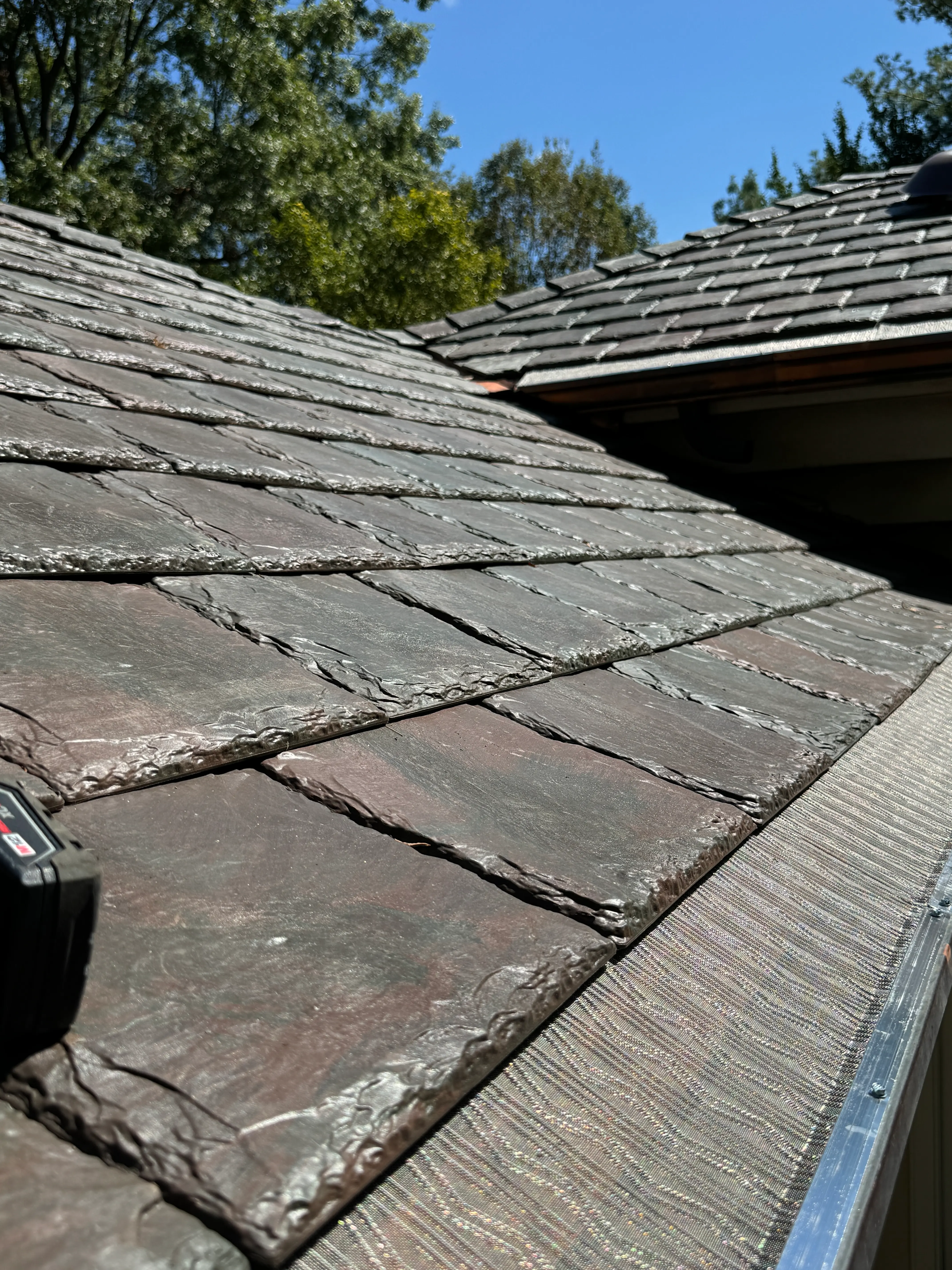 Gutter guard installation fitted beneath a residential roofline